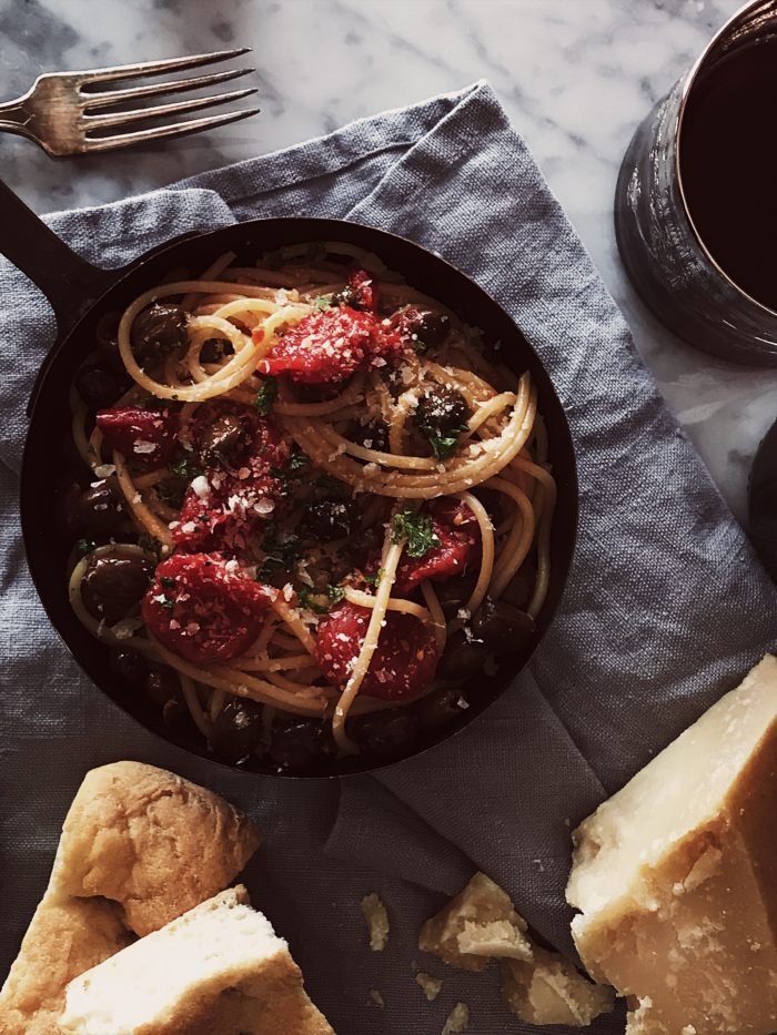 The traditional pasta puttanesca recipe a tomato sauce with olives, capers and anchovies. Plus, the origins of the puttanesca sauce.